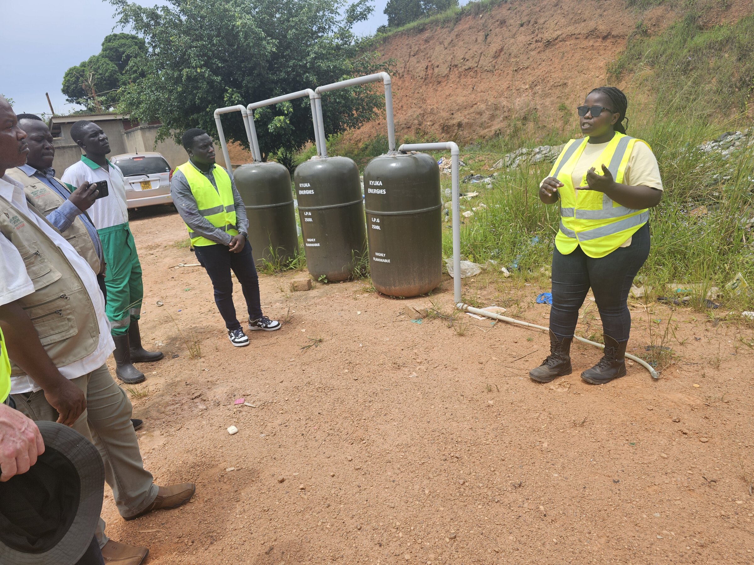 Kyuka Ventures field team installing LPG storage tanks at a community site in Uganda